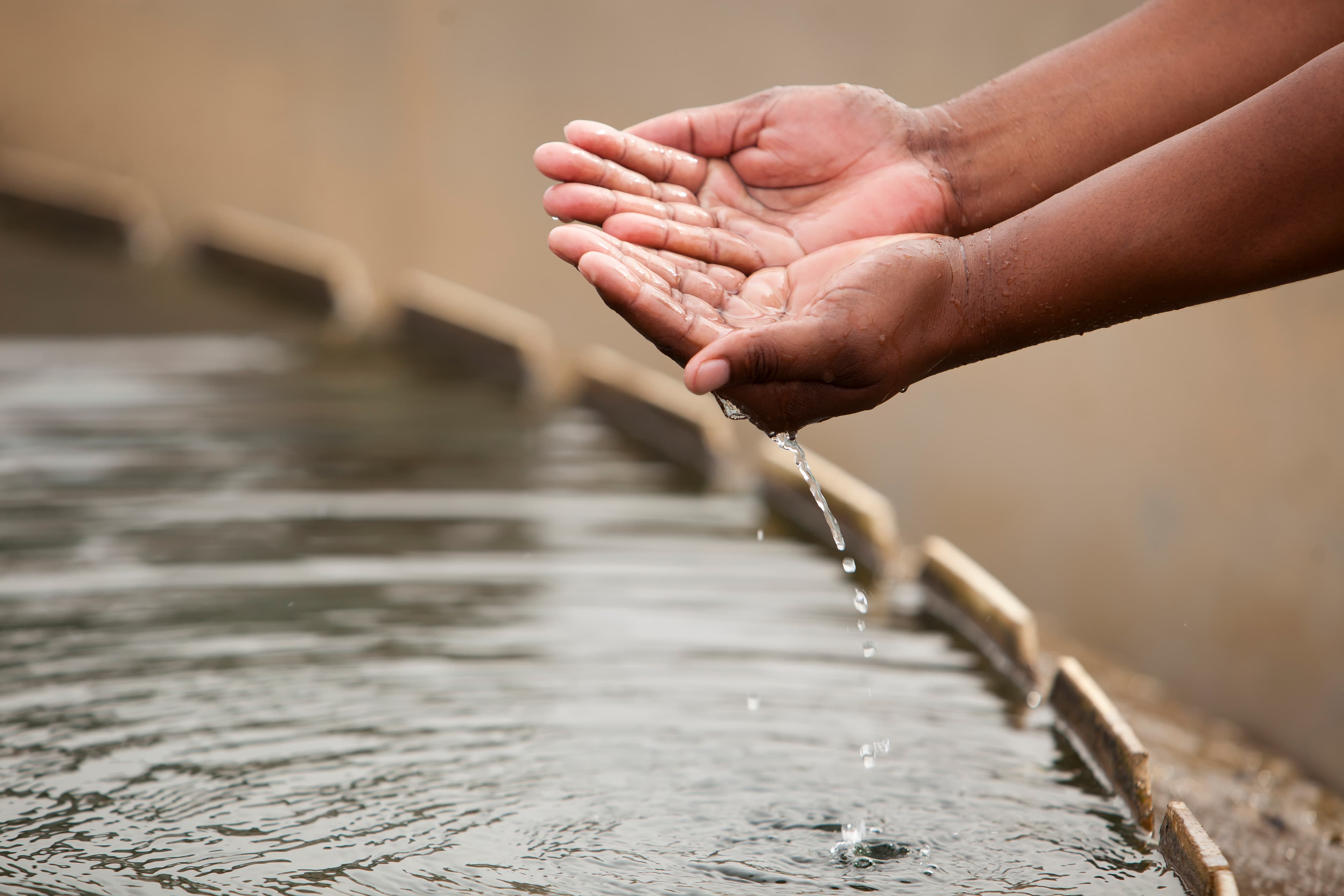Hands cupping clean water